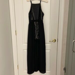 Black jumpsuit with sequin top and shorts. Xs. New with tags.